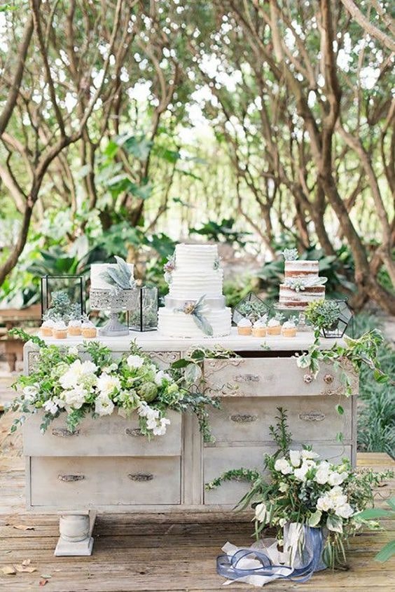 Gorgeous cake table at an outdoor wedding